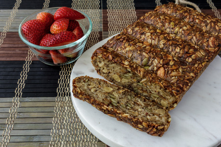 Vegan nut loaf with strawberriesの写真素材