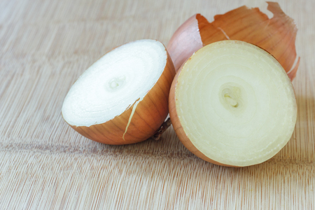 Onion on cutting boardの写真素材