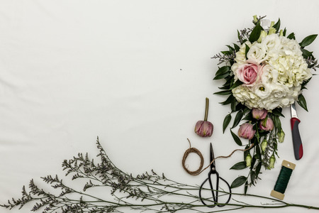 flower arrangement flat lay with toolsの写真素材