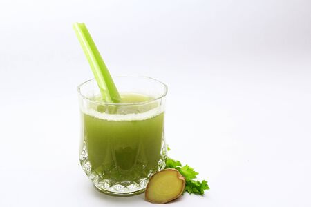 fresh and healthy celery and ginger juice on white background.の写真素材