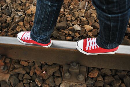 red sneaker on the railwayの写真素材