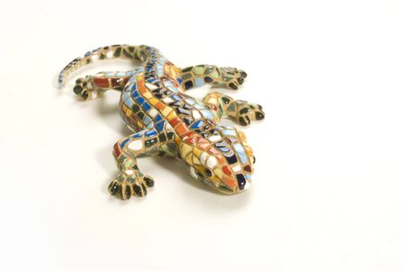 A photograph of a toy lizard against a white background の写真素材
