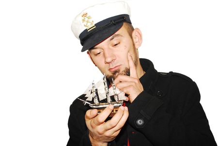 young captain dreaming to have his own shipの写真素材