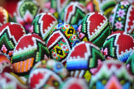 Collection of many colourful handmade easter eggs backgroundの写真素材