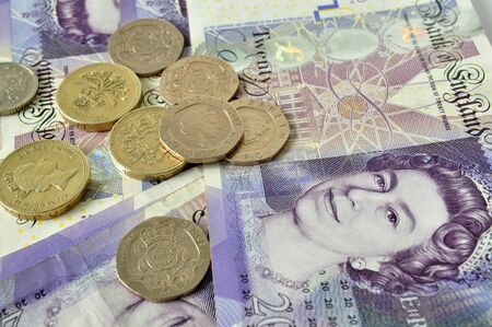 British currency coins and notes mixed together