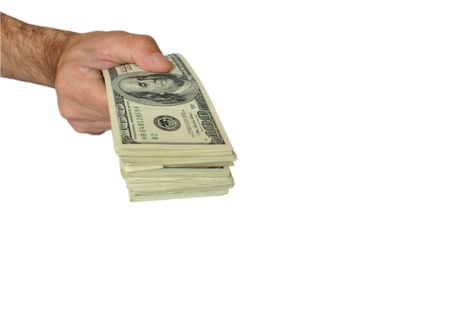 offering dollars stack in the hand isolated on white background
