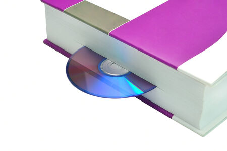 compact disk inserted in book isolated on white representing audiobook conceptの写真素材