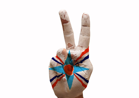 Hand making the V sign assyrian people flag paintedの写真素材