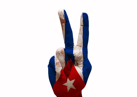 Hand making the V sign cuba country flag paintedの写真素材