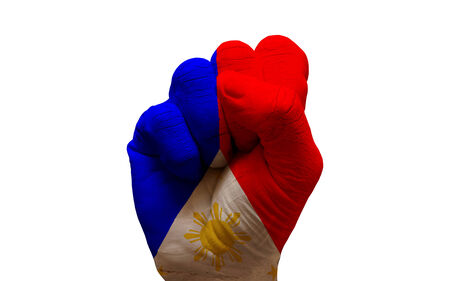 man hand fist painted country flag of philippinesの写真素材