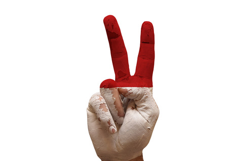 grunge painted hand making the V sign isolated over white backgroundの写真素材