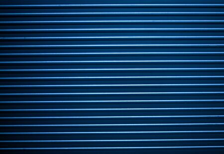 Horizontal ridged blue metal stripes pattern textureの写真素材