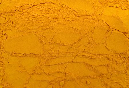 indian spice turmeric powder texture pattern background