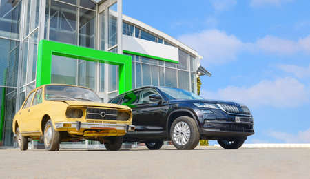 old car versus new car front face to face