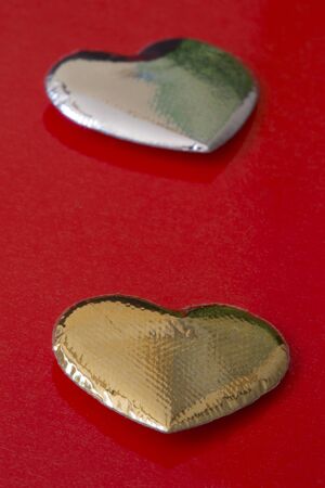 gold and silver heartsの写真素材