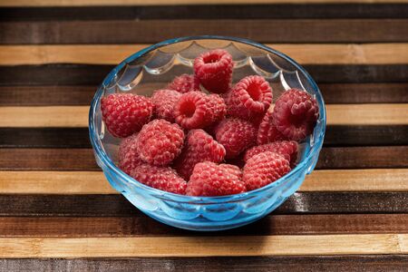 raw raspberries in a glassの写真素材