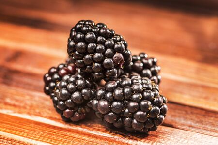 blackberries on wooden backgroundの写真素材