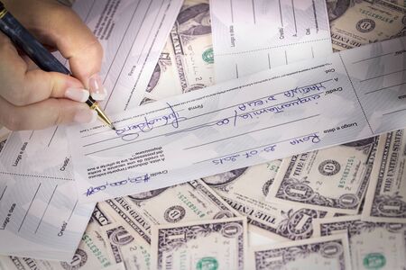 partner signed a check to another partnerの写真素材
