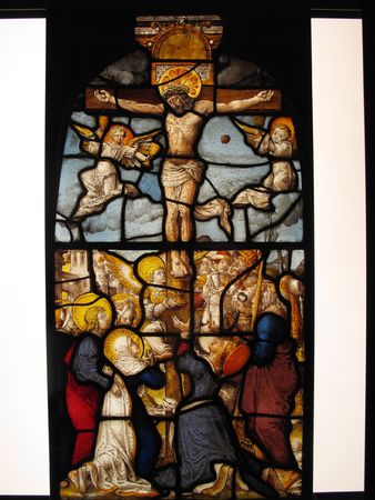 The Crucifixion of Christ shown in an image on a medieval 16th century stained glass panel from the cloisters of Steinfeld Abbey near Cologne Germanyの写真素材