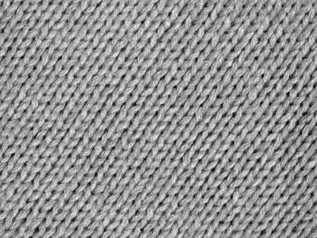 Knitted wool fibre background shown in black and white monochrome
