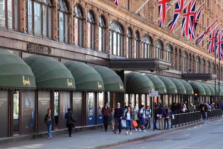 London, United Kingdom, May 1, 2011 : Exterior of Harrods department store in the Brompton Road, Knightsbridge showing shoppers passing byのeditorial素材