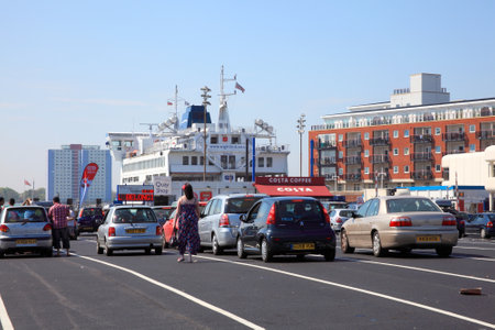 Portsmouth, United Kingdom, Apr 22, 2011 :  Portsmouth International Port with a car ferry having docked with its passengers in their cars   queueing to boardのeditorial素材
