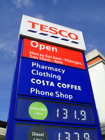 London, UK, Jun 14, 2011 : A Tesco petrol station sign showing its company logo and petrol price at its Perival supermarket on the Western Avenueのeditorial素材