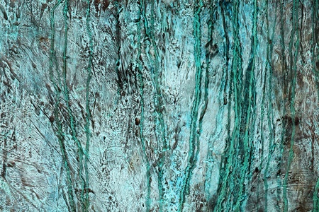 Bronze weathered background covered in rough green verdigris