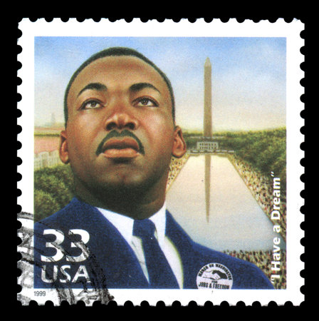 USA postage stamp of 1999 showing an image of Martin Luther King with his famous quotation of 'I have a dream' and with the Washington Monument in the backgroundのeditorial素材