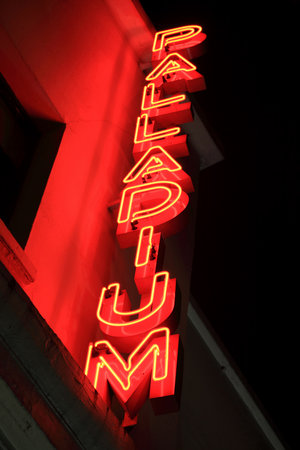 London, UK  November 1, 2011: Red neon London Palladium sign lit at night outside the theatre, which is situated in Argyll Street, Soho off Oxford Streetのeditorial素材