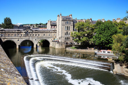Pulteney Bridge across the River Avon in Bath, Somerset, England, UK, designed by Robert Adams and completed in 1773,  it is only one of only four bridges in the world lined with shopsのeditorial素材