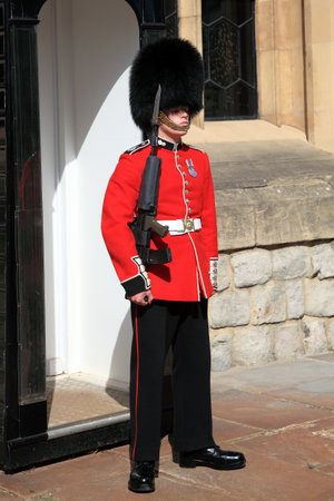 London, UK - September 9, 2012: Coldstream Guard standing at his sentry box on guard at the Tower of Londonのeditorial素材