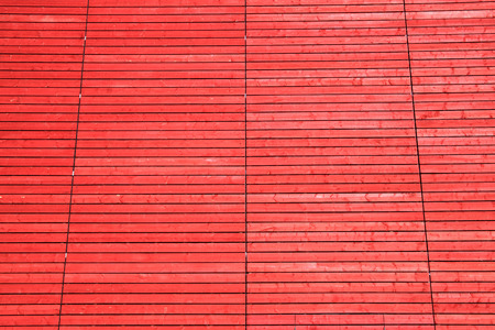 Wood planks panels fence wall background with red wash paintの写真素材