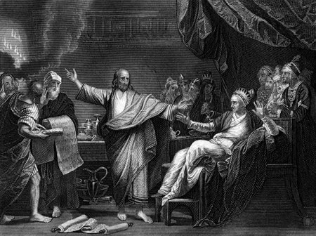 An engraved illustration image of Daniel Interpreting The Writing On The Wall , from a vintage Victorian bible dated 1852 that is no longer in copyrightのeditorial素材