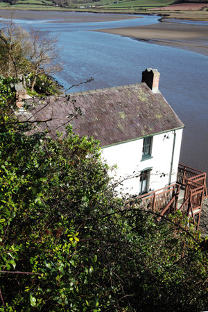 Laugharne,Wales, UK, February 24, 2016 : The Dylan Thomas Boathouse overlooking the Taf estuary,where the poet lived for the last four years of his lifeのeditorial素材