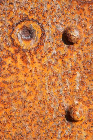 Background of old distressed iron panel covered in rustの写真素材