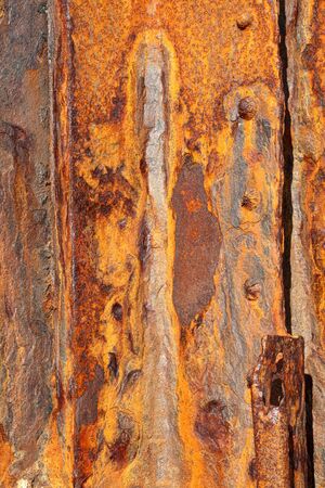 Background of old distressed iron panels covered in rustの写真素材