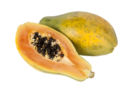 Papaya fruit halved cut out and isolated on a white backgroundの写真素材