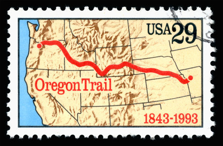 London, UK, February 19 2018 - Vintage 1993 United States of America 29c cancelled postage stamp showing an image of the anniversary of the Oregon Trailのeditorial素材