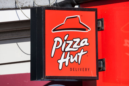 Swansea, Wales, UK, June 30, 2018 : Pizza Hut logo advertising sign outside its restaurant in St Helen's Roadのeditorial素材