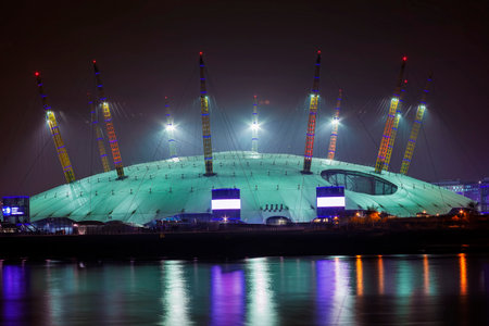 London, UK, October 28, 2011: The Millennium Dome on the River Thames in Greenwich at night  known as the O2 Concert Hall and is a popular travel destination tourist attraction landmark of the city stock photoのeditorial素材