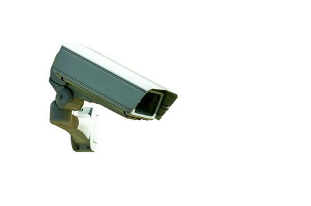 CCTV security camera system being used for surveillance cut out and isolated on a white background,...