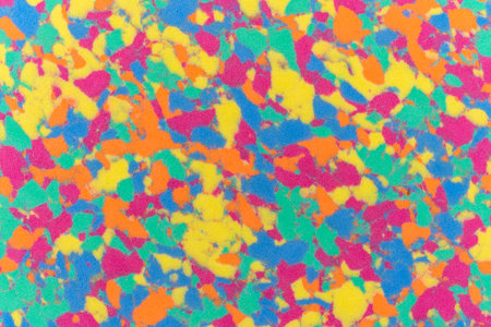 Sponge texture background with a multi coloured textured effect with all the colours of a pattern...