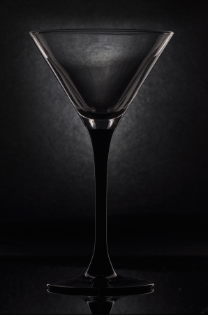 empty martini glass on a black backgroundの写真素材