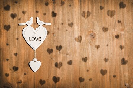 Valentine's Day, pigeons in love on heart, wood background loveの写真素材
