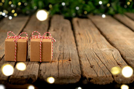 Christmas gifts on old wooden tableの写真素材