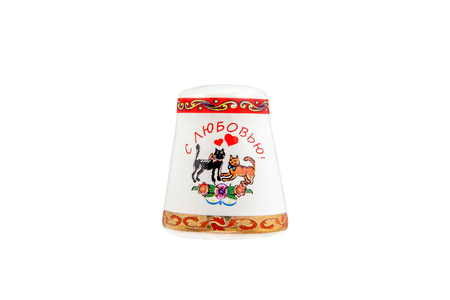 ceramic souvenir toy in the form of thimble with beautiful color painting on isolated white background reflecting the national Russian culture with the inscription in Russian: "With love"の写真素材