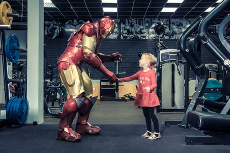 RUSSIA, YAROSLAVL - 17 NOV. 2018: Animators iron man and spider man in the fitness gym with bodybuilding equipment. Toned.のeditorial素材