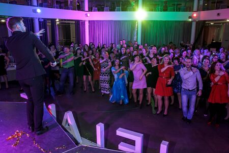 RUSSIA, YAROSLAVL -  27 DEC. 2016: Corporate party company Oriflame with leading and dancing on the occasion of the end of the year of sales and the new year, with a lot of people.のeditorial素材