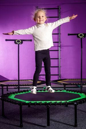 RUSSIA, YAROSLAVL - 16 DEC. 2018: training in the gym of a happy child in the classroom for jumping and trampolining.のeditorial素材